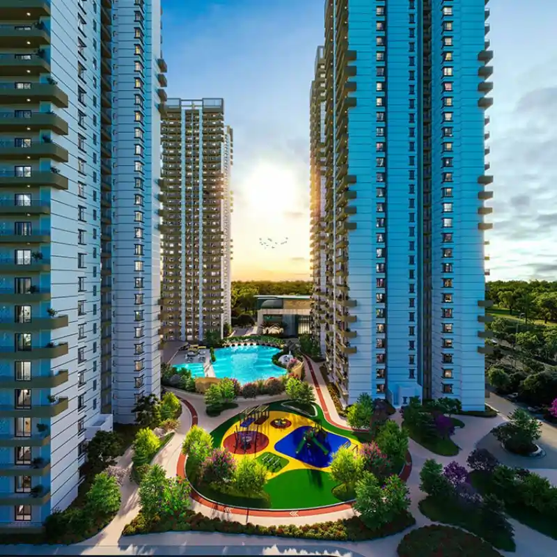Wave Eden residential towers with turquoise pool and lush landscaping at twilight