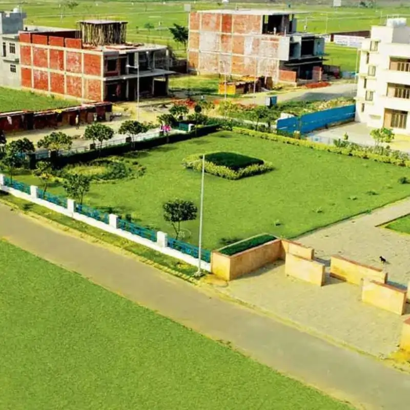 Wave City Plots developed section with landscaped plots and white boundaries