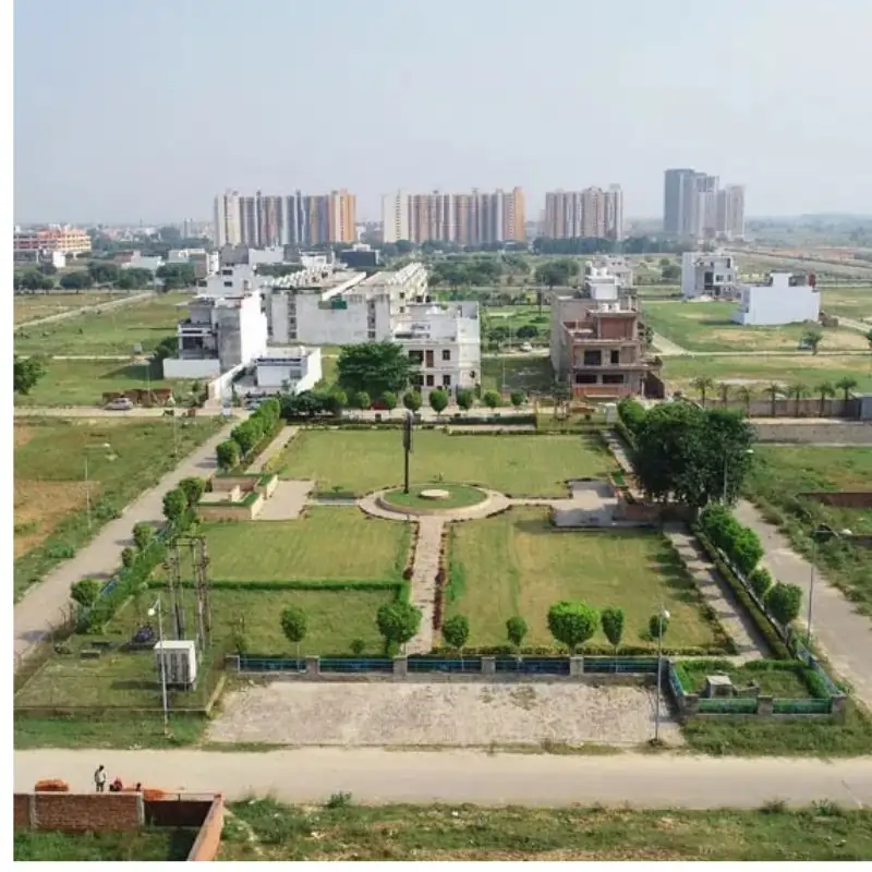 Wave City Plots premium residential area with buildings and manicured gardens