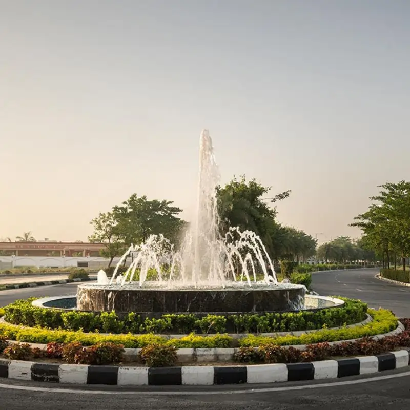 Wave City Plots central fountain and landscaping amenity